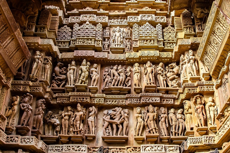 Close up of artful carved walls of Kandariya Mahadeva Temple, Khajuraho Group of Monuments.