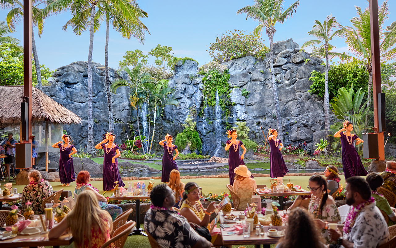 Enjoying a vibrant Ali'i Luau feast, immersed in Polynesian culture and dance