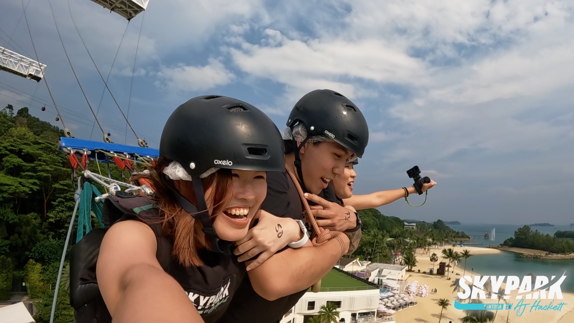 people riding the sentosa giant swing