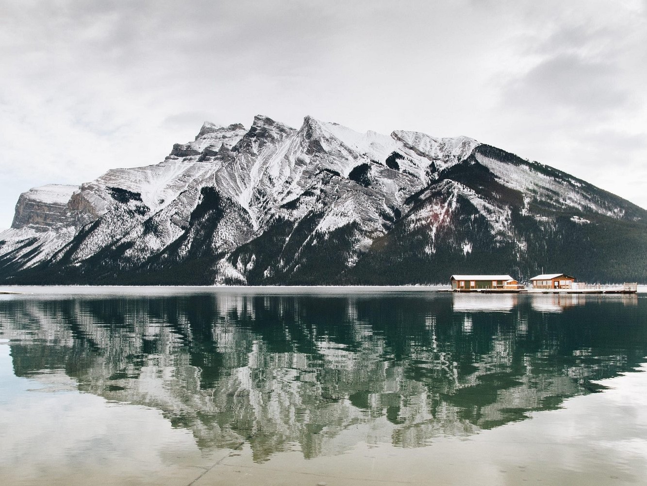 Capture frozen beauty and snowy serenity at Lake Minnewanka during a Banff winter escape