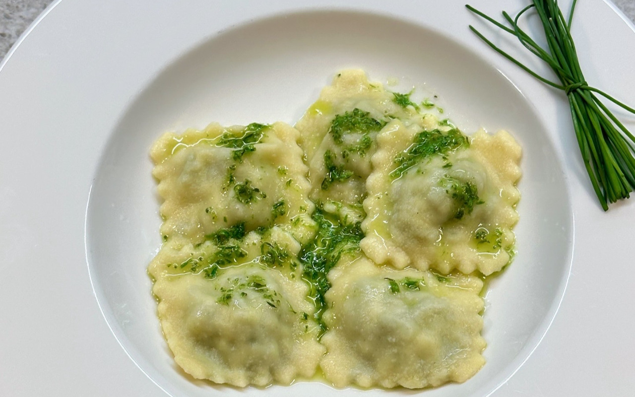 Experience the joy of cooking and eating authentic Tuscan dishes in a family kitchen