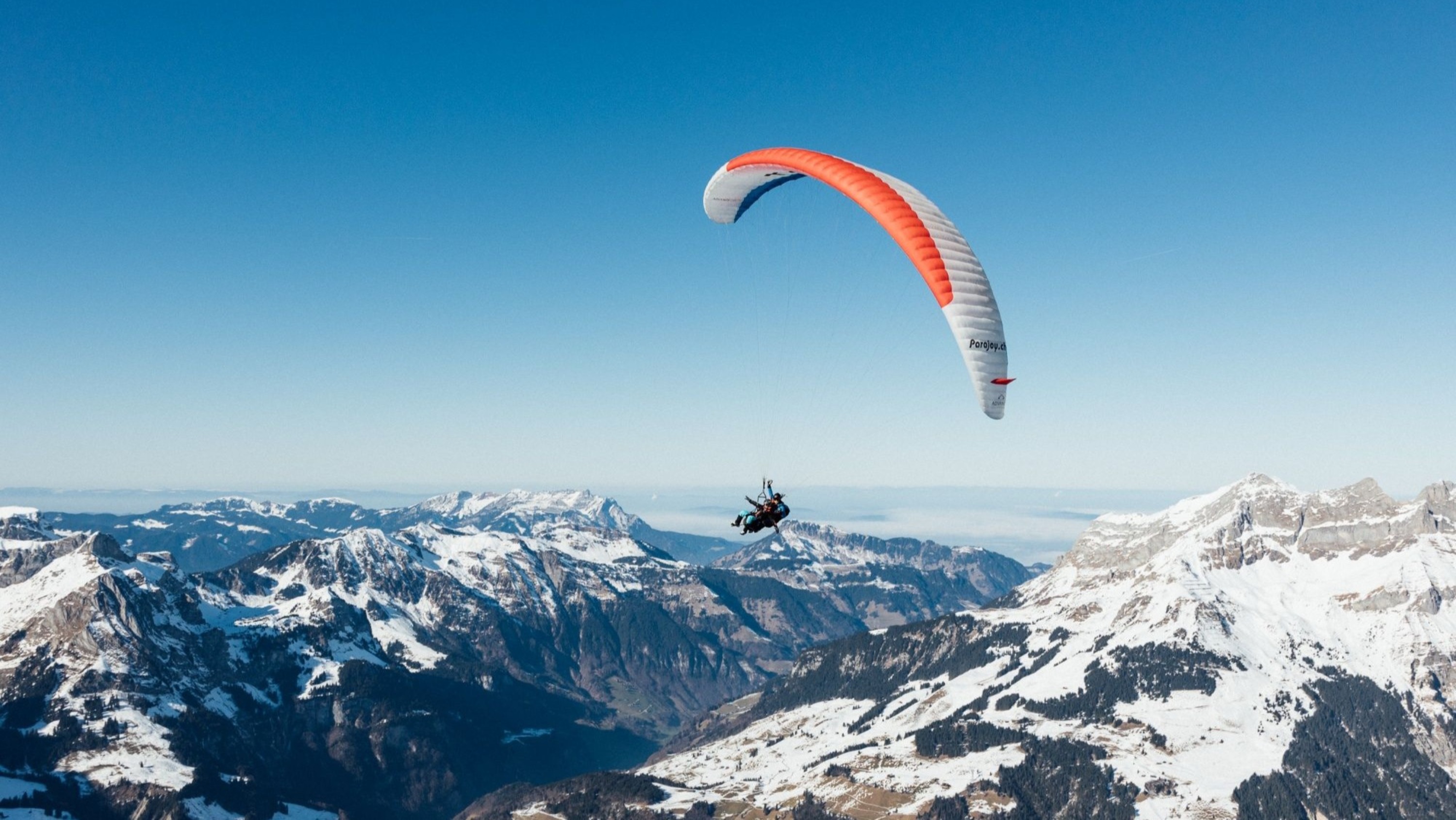 Experience the freedom of flight and the thrill of paragliding over scenic Engelberg