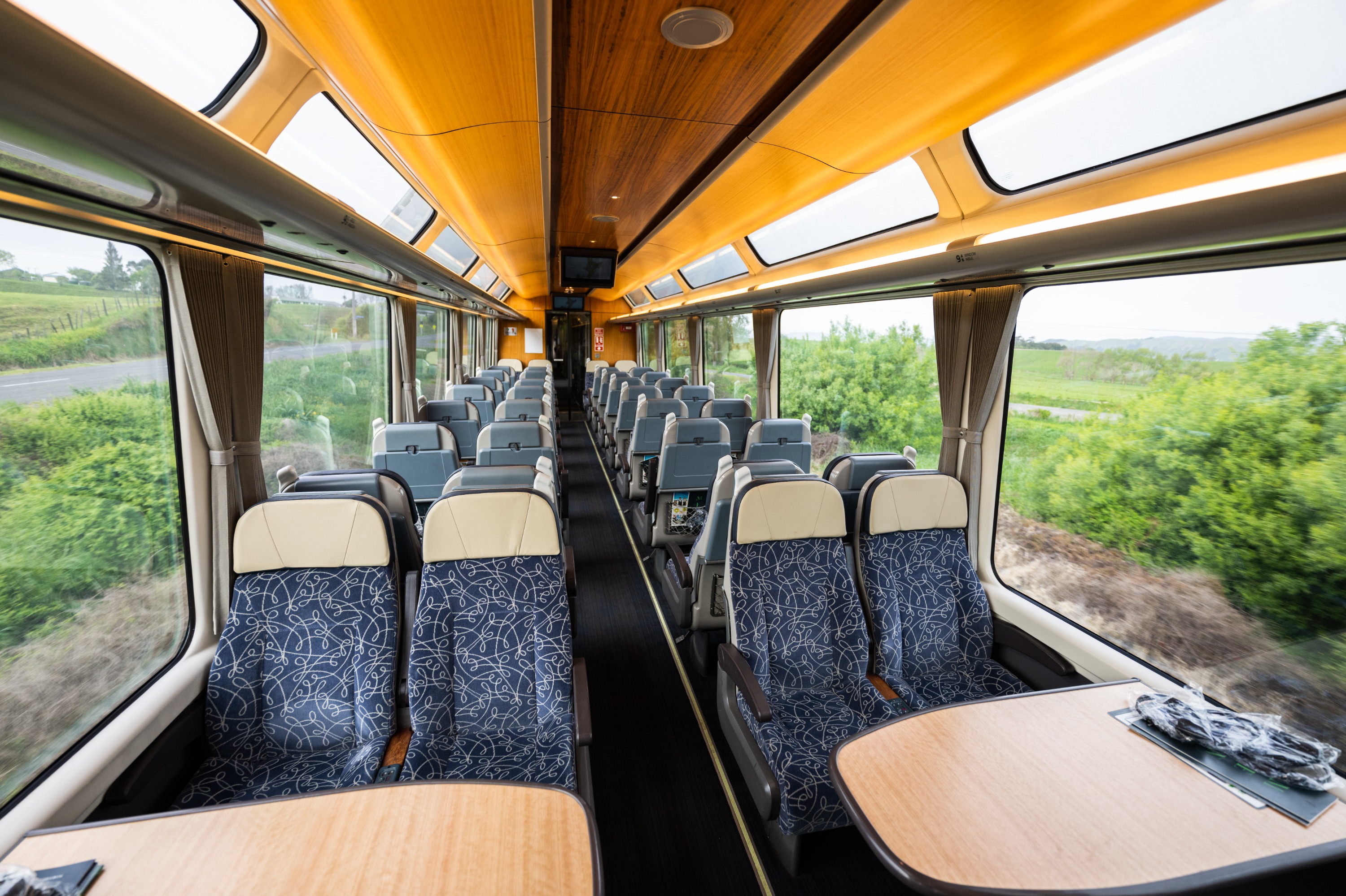 Relax in comfortable seating and enjoy onboard amenities during your journey across the Southern Alps