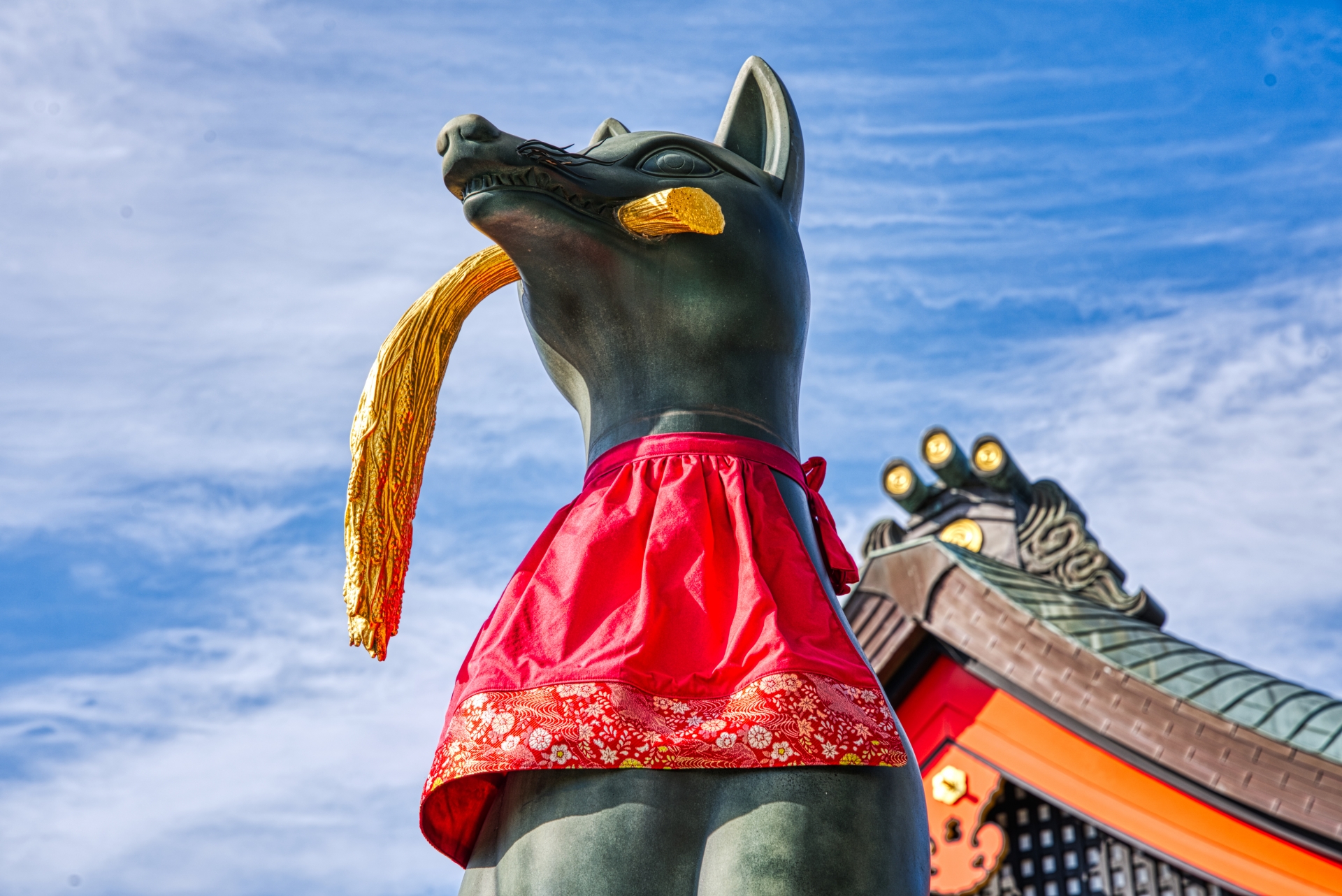 The fox holding a rice ear is the symbol of the Inari Shrine's messenger.