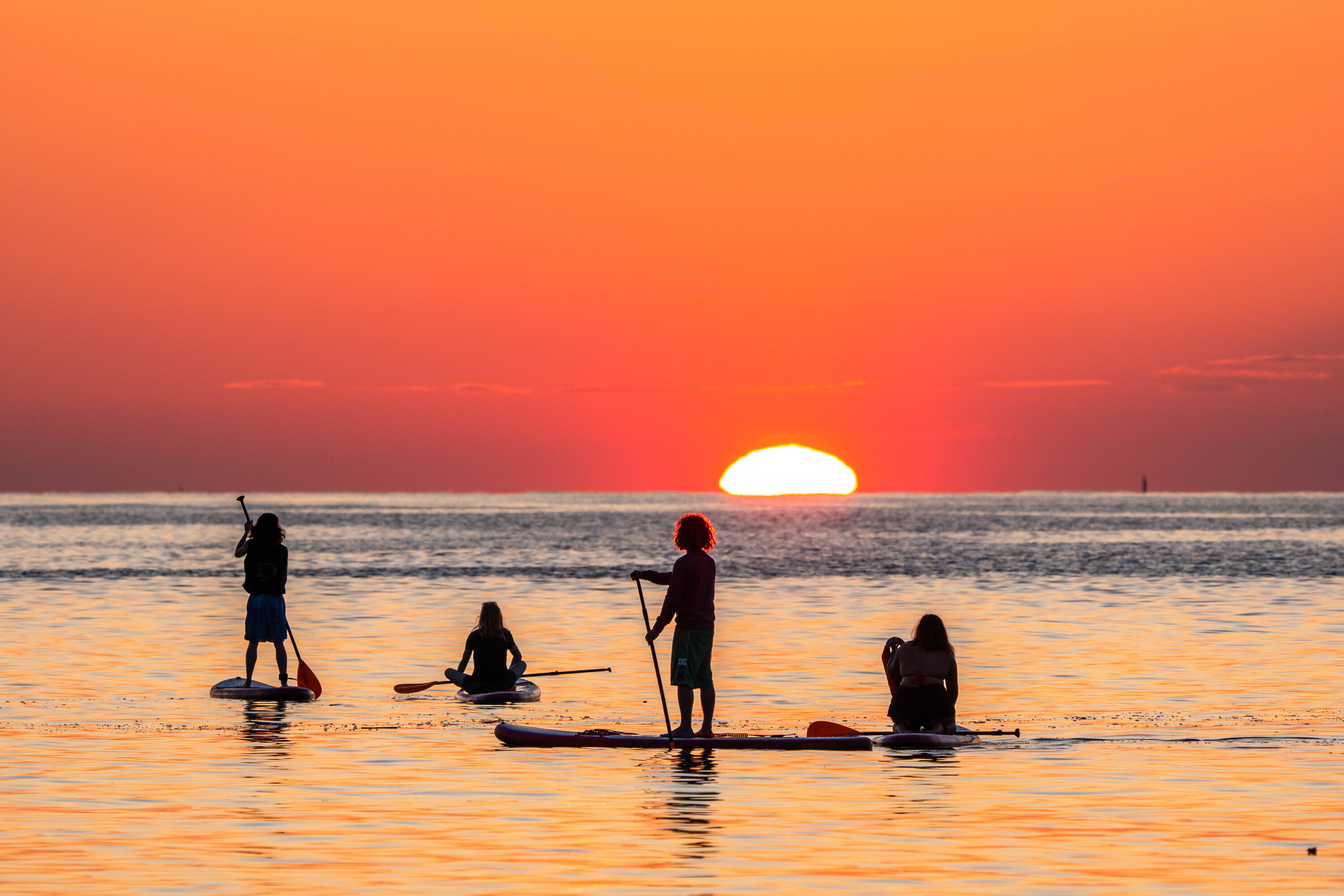 Enjoy an unforgettable sunrise while paddle surfing in Barcelona
