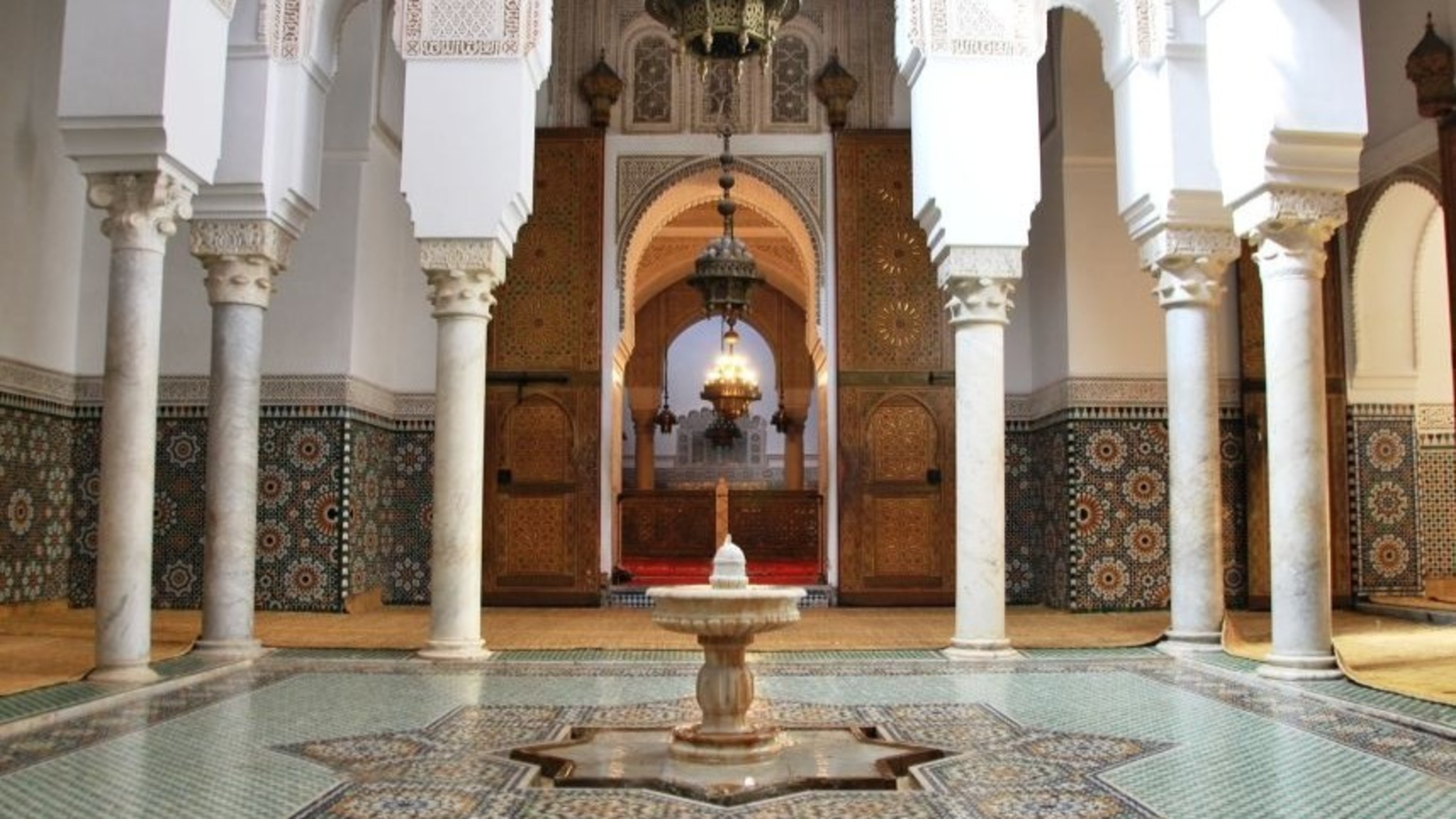 Marvel at the intricate tilework and ornate arches of the Mausoleum of Moulay Ismail