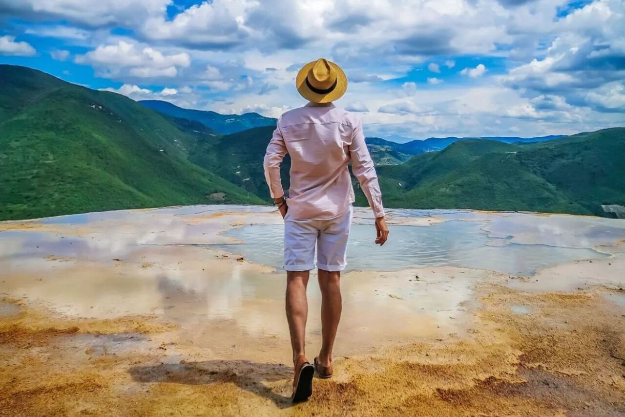 Traveler capturing the stunning Hierve el Agua scenery with a camera