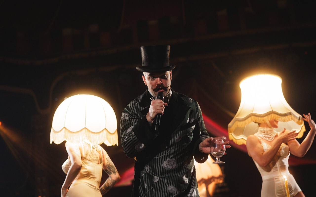 Dazzling lights and vintage charm create a glamorous atmosphere inside the mirror tent