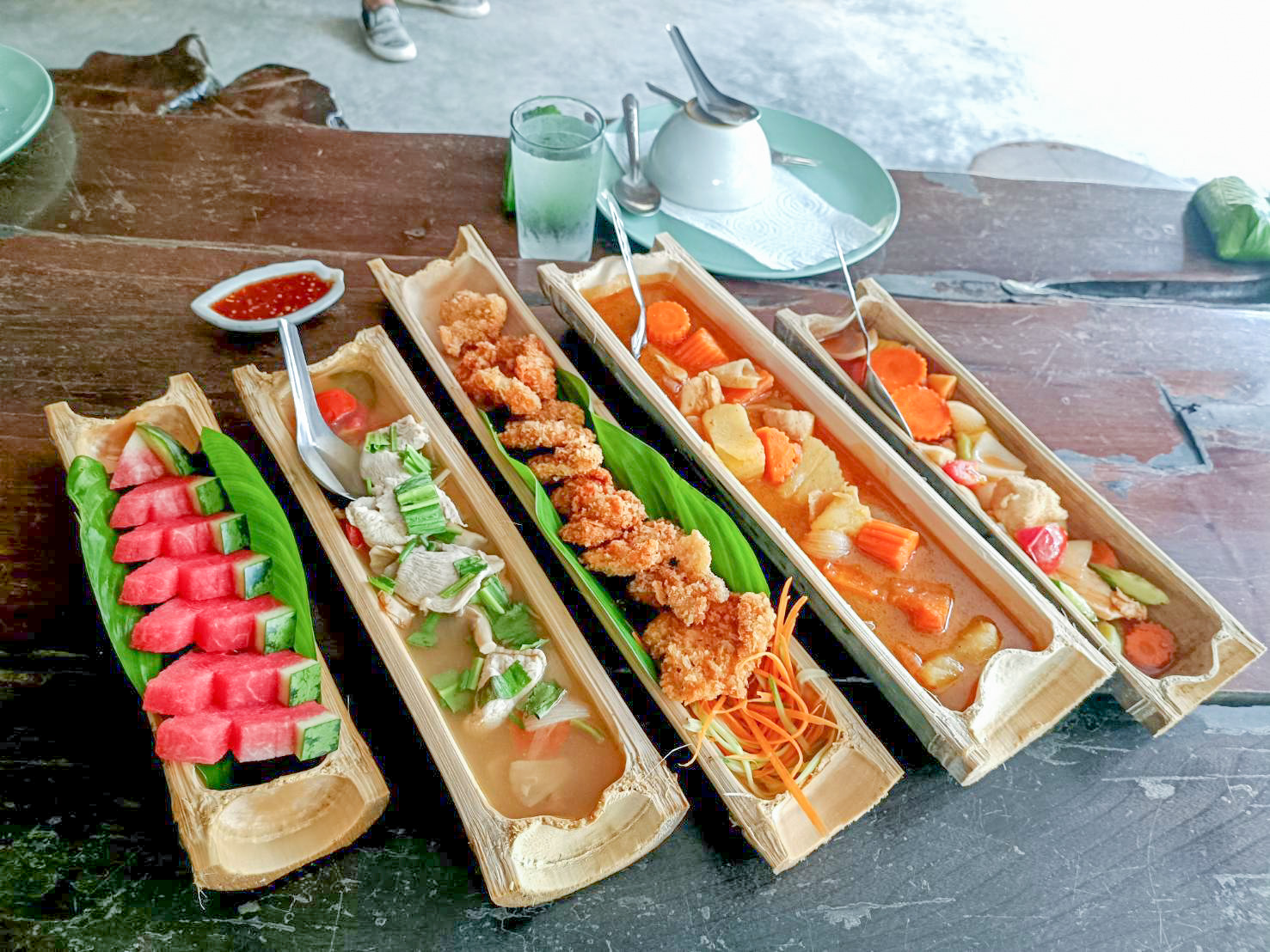 Savor the authenticity of Thai cuisine in a jungle ambiance, where your meal is artfully presented and served in traditional bamboo steamware.