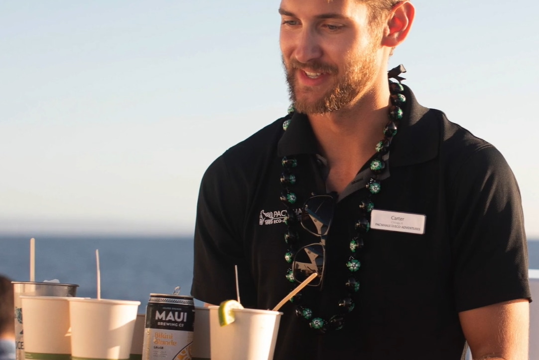 Experience warm Maui hospitality with refreshing drinks served by our friendly crew on this sunset sail