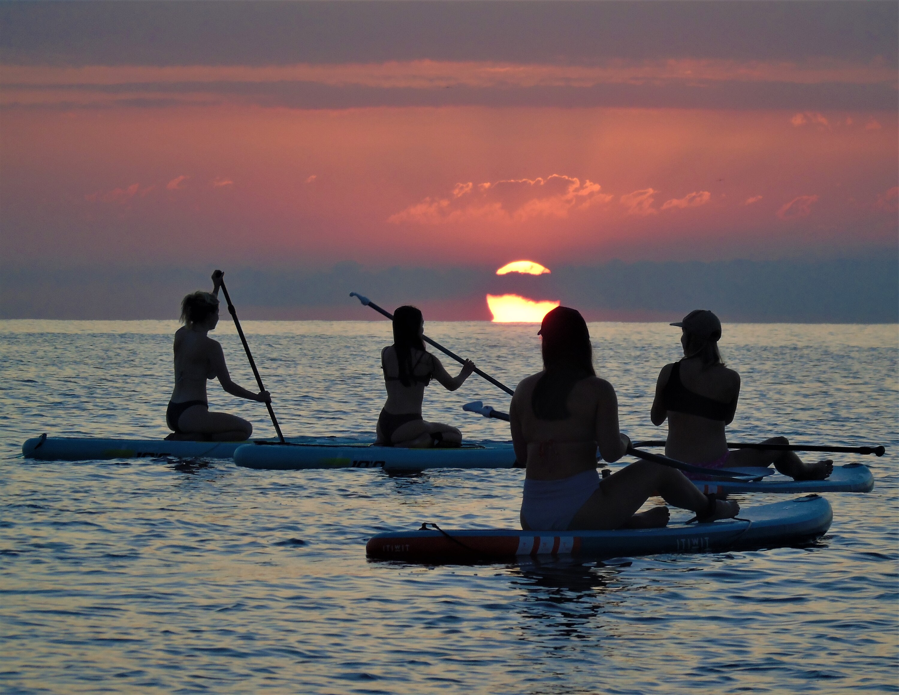 Group paddle session with stunning morning views of the sea