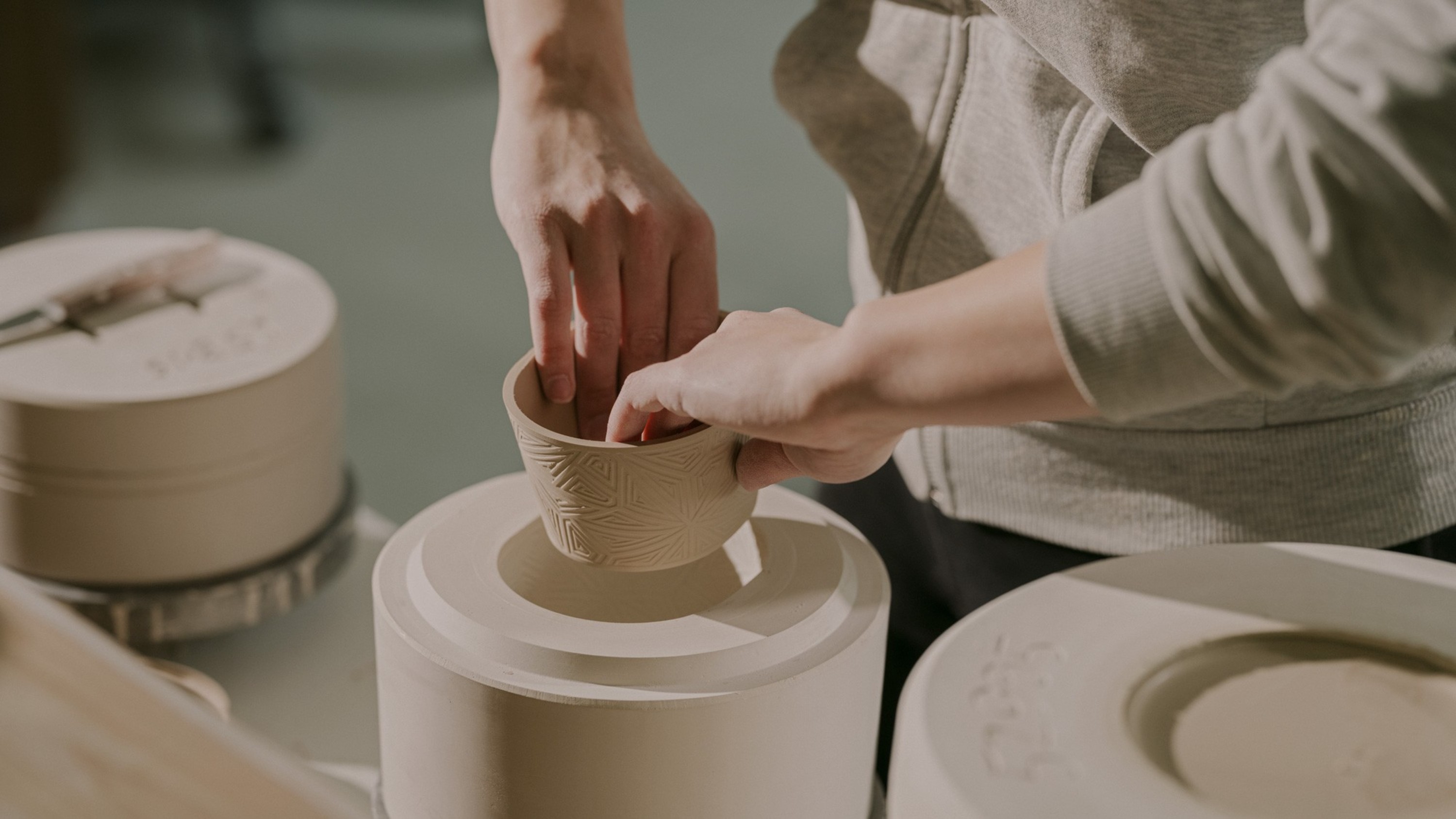 Delicately unveiling intricate porcelain details straight from the mold—precision in every step