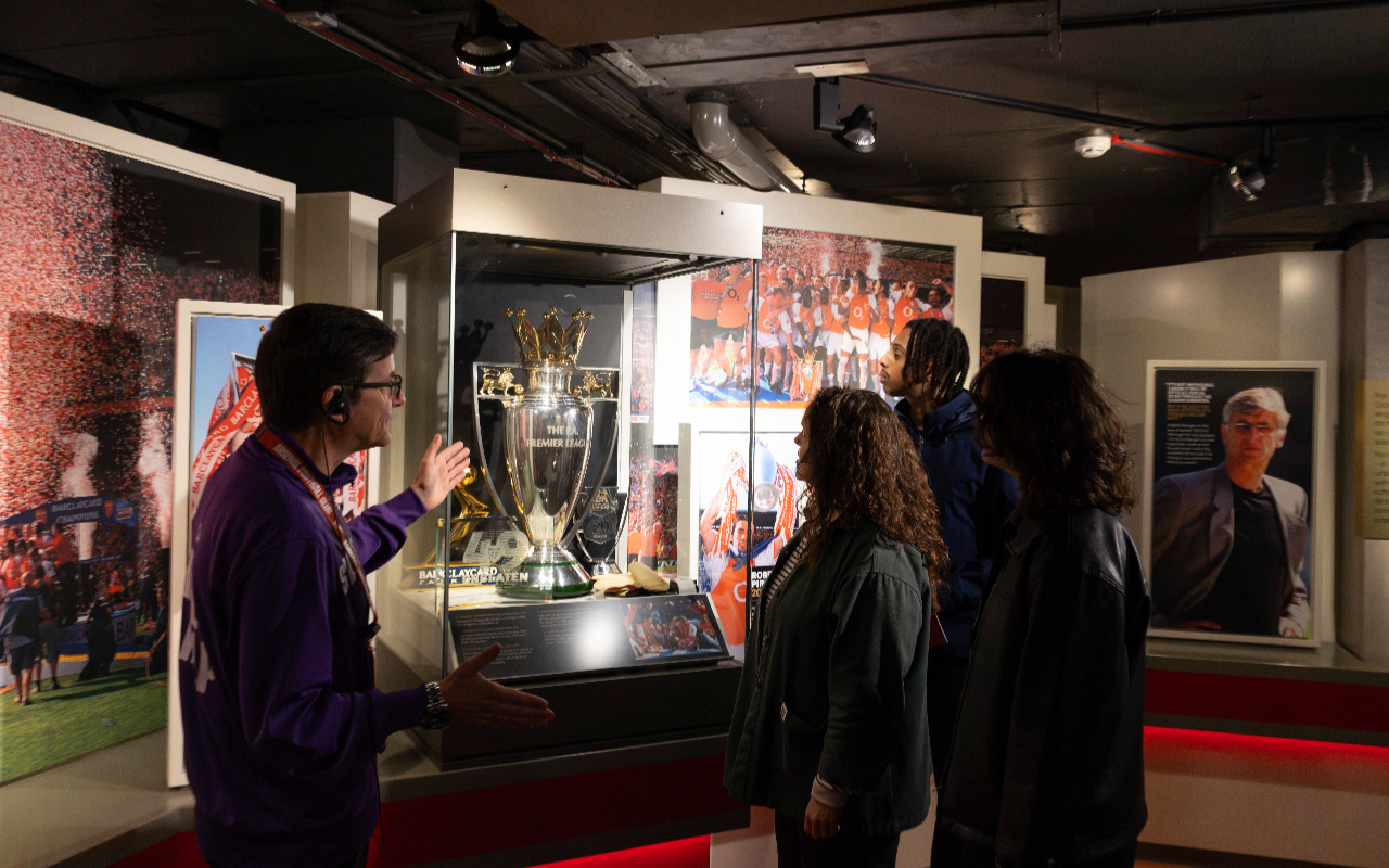 Admiring the legendary Premier League trophy, soaking in football's glorious past