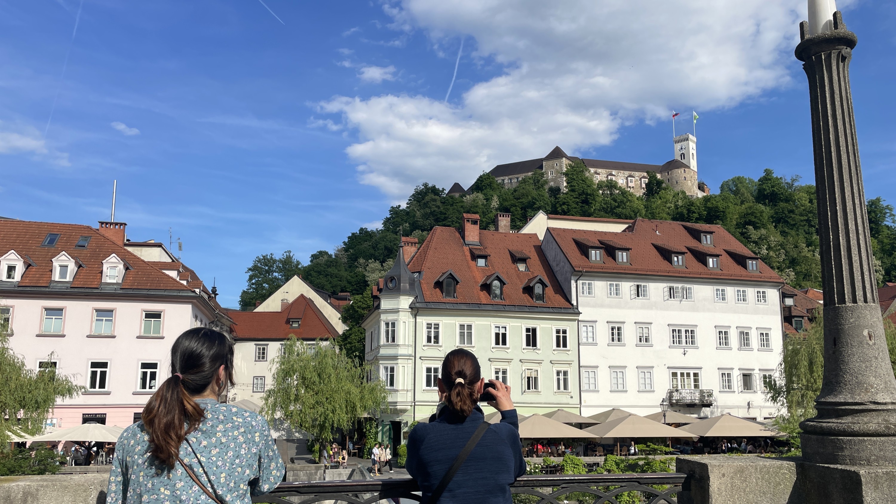Charming old town square with historic buildings and tall monument