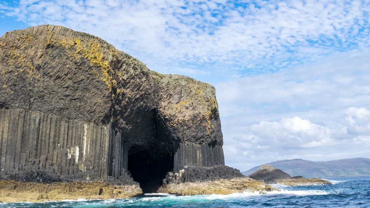 A breathtaking natural wonder, Fingal's Cave features stunning hexagonal basalt columns and vibrant sea