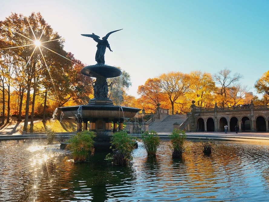 Visit Bethesda Terrace and Fountain surrounded by stunning architecture and lively park atmosphere