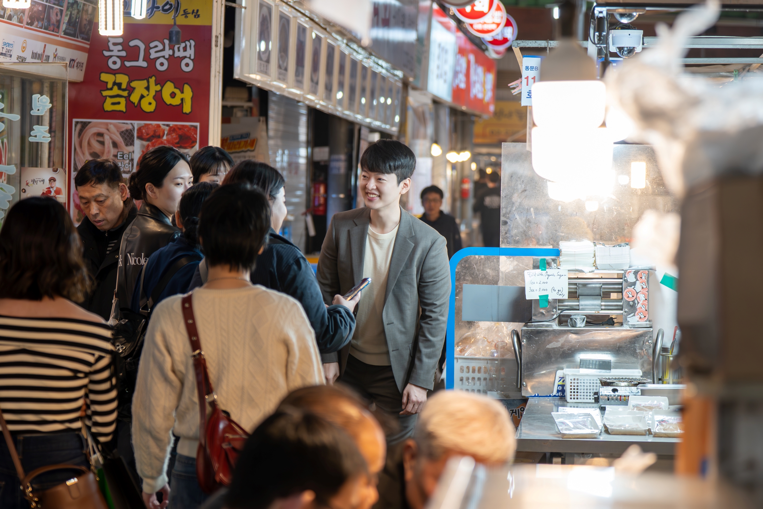 Walking down Gwangjang Market’s lively food lane.