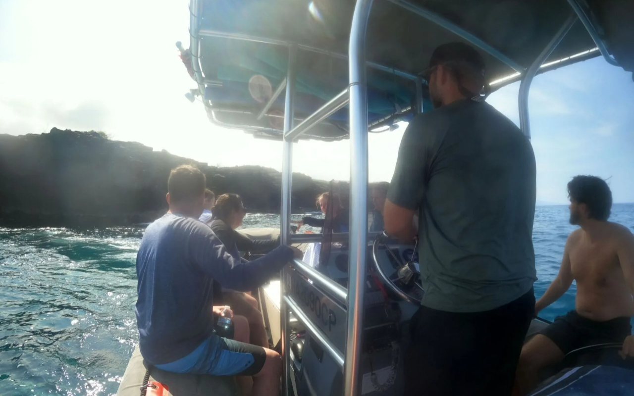 Cruise Kona’s crystal waters, exploring colorful coral gardens and hidden sea caves