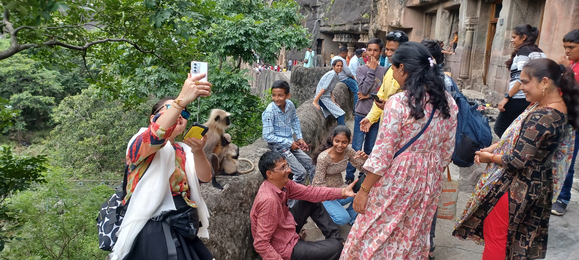 Visitors are playing money near Ajanta Caves.