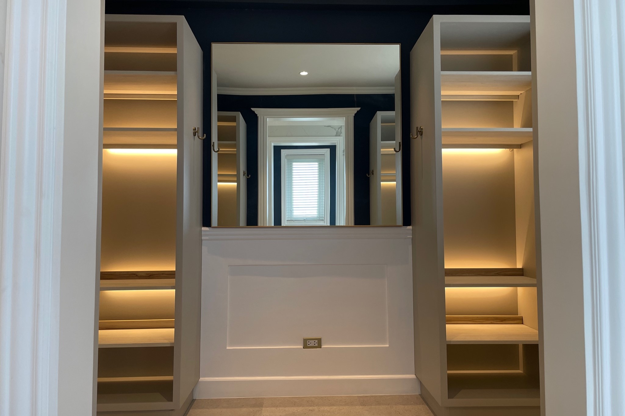 Spacious walk-in closet with shelves and lights