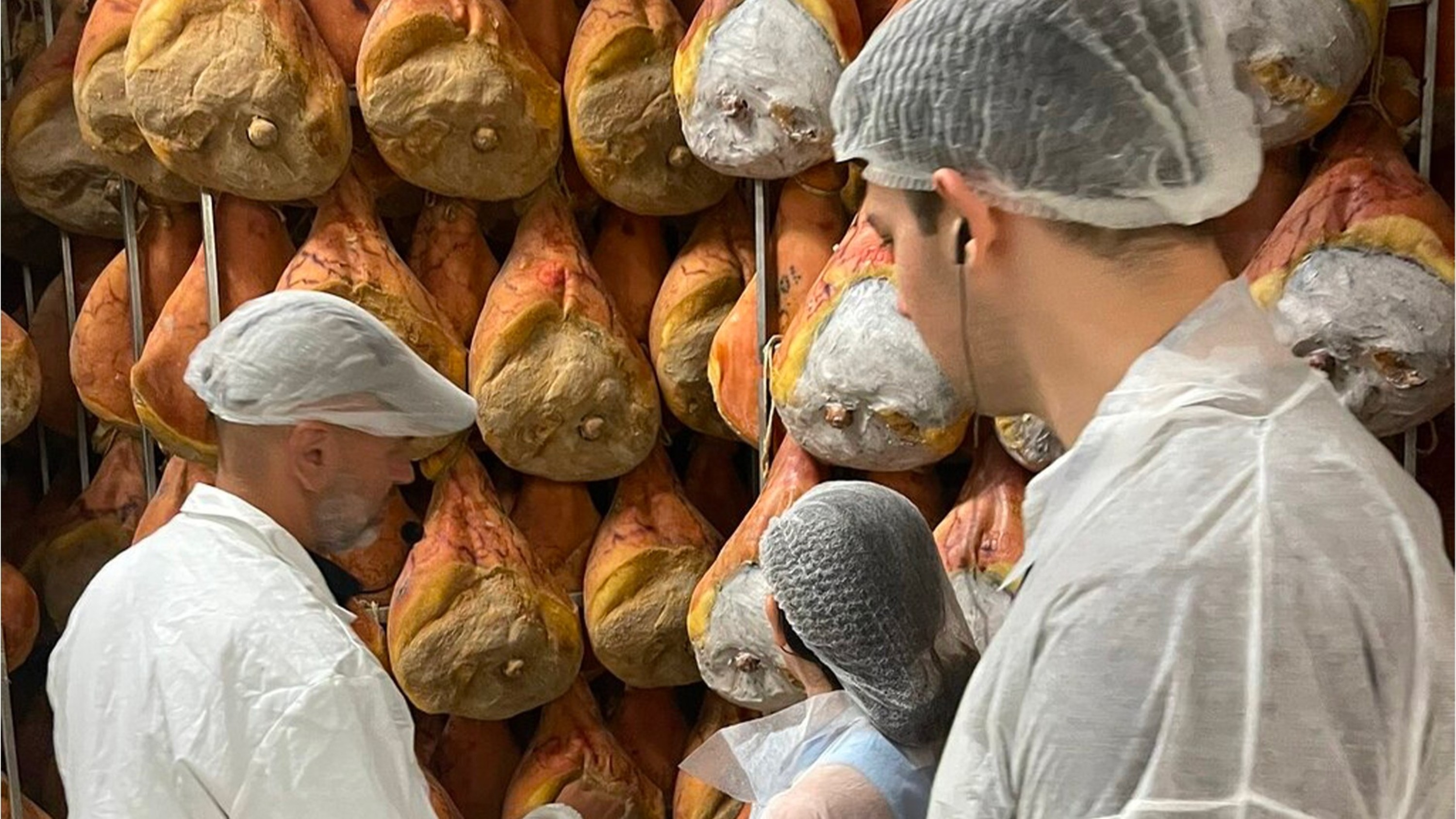 Step inside the ham factory and witness the tradition of producing authentic Parma Ham