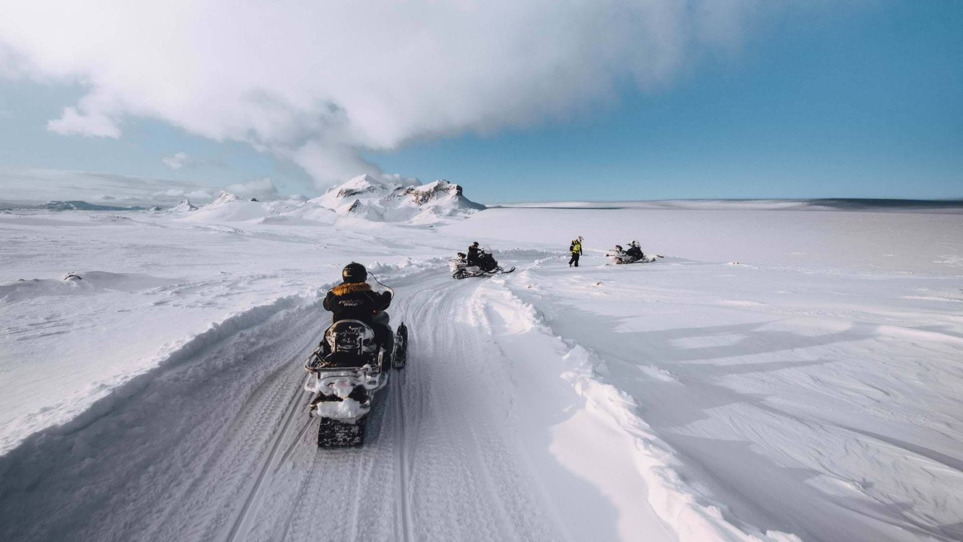 Ride through rugged landscapes in a super jeep before snowmobiling across a glacier
