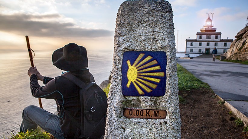 Witness the iconic lighthouse of Finisterre, a must-see on your journey