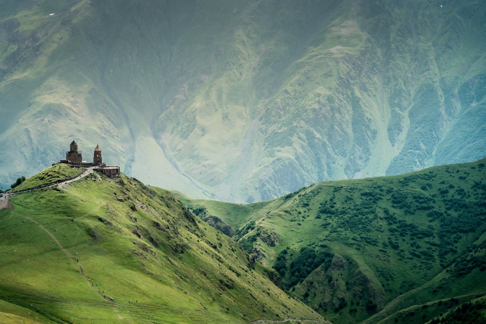 Gergeti Church and Fortress
You surely saw such postcards: an ancient monastery standing on a hill on a background of snow-capped mountains. For these species in reality, you will go to the village of Stepantsminda at the foot of Kazbek. And there you wil