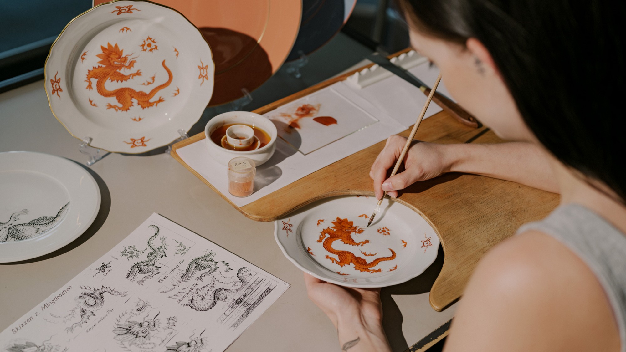 Marvel at hand-painted porcelain designs, crafted with precision and inspired by historic Meissen motifs