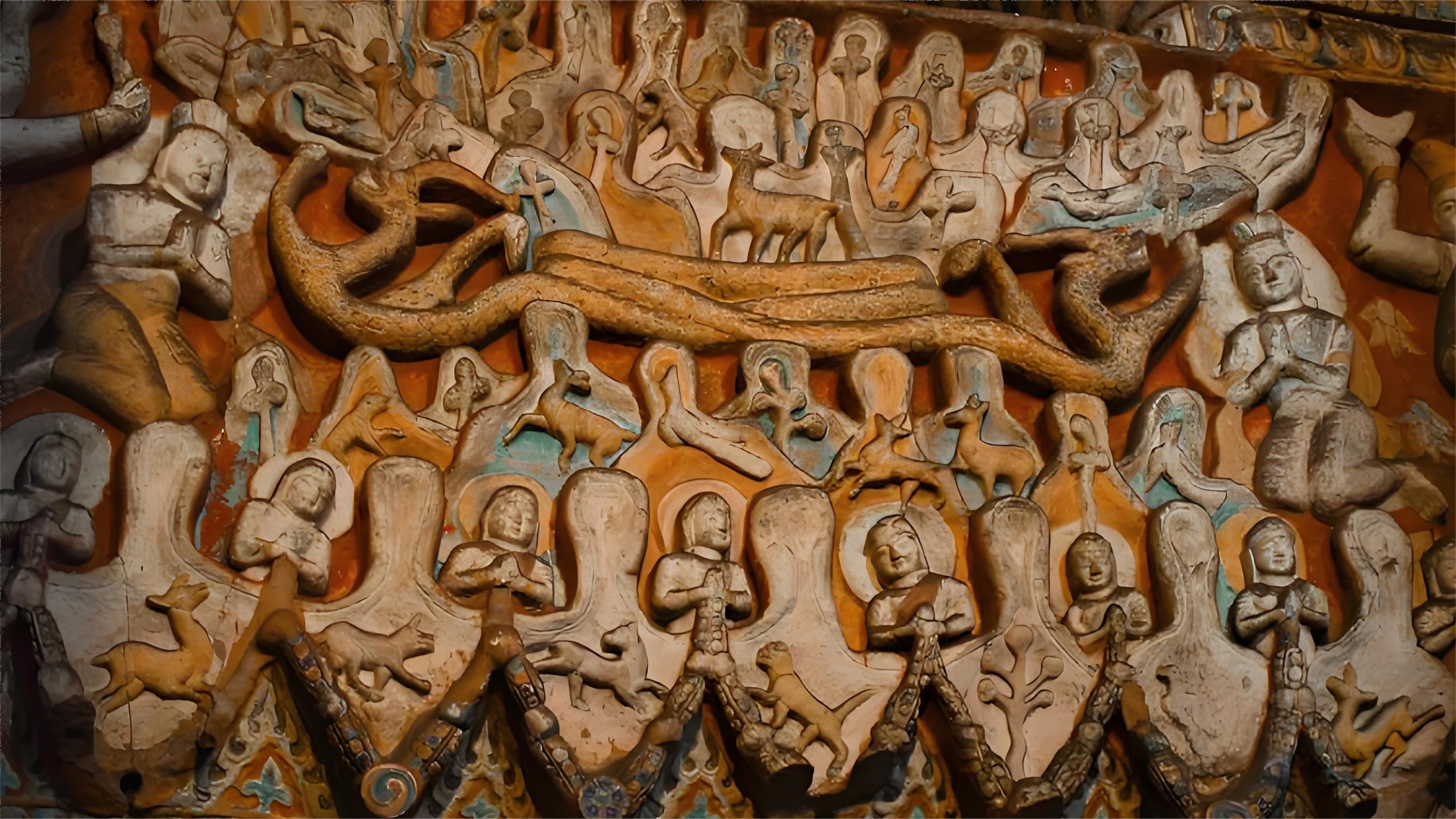 雲岡石窟佛窟內的石刻,以雄渾大氣的造像、細膩繁複的紋飾和多元融合的風格,展現了北魏時期佛教藝術的巔峰成就,其中曇曜五窟的巨型佛像與飛天樂伎浮雕尤為震撼。 雲岡石窟佛窟內的石刻,以雄渾大氣的造像、細膩繁複的紋飾和多元融合的風格,展現了北魏時期佛教藝術的巔峰成就,其中曇曜五窟的巨型佛像與飛天樂伎浮雕尤為震撼。