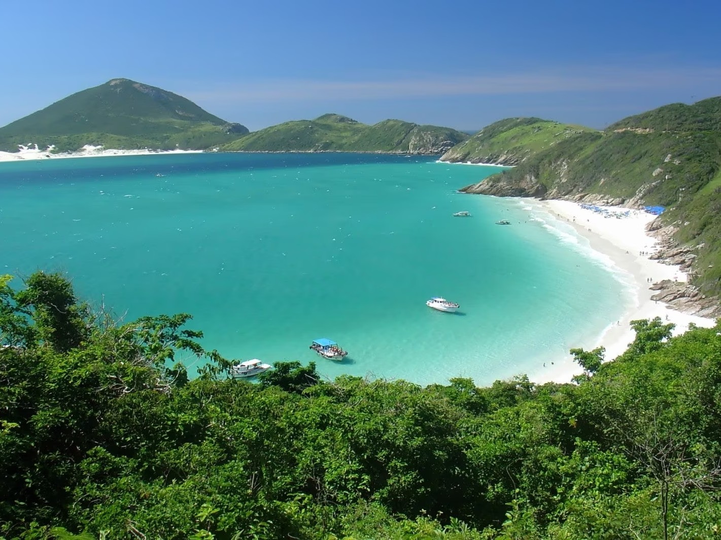 Capture the breathtaking Praia do Farol view surrounded by white sand and cliffs