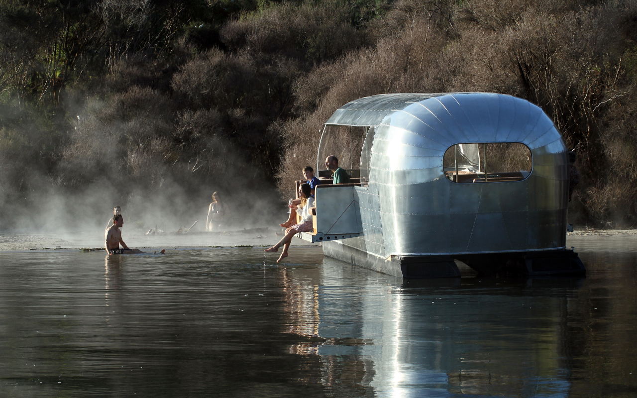 Explore Lake Rotoiti’s geothermal bays on a handcrafted, one-of-a-kind vessel