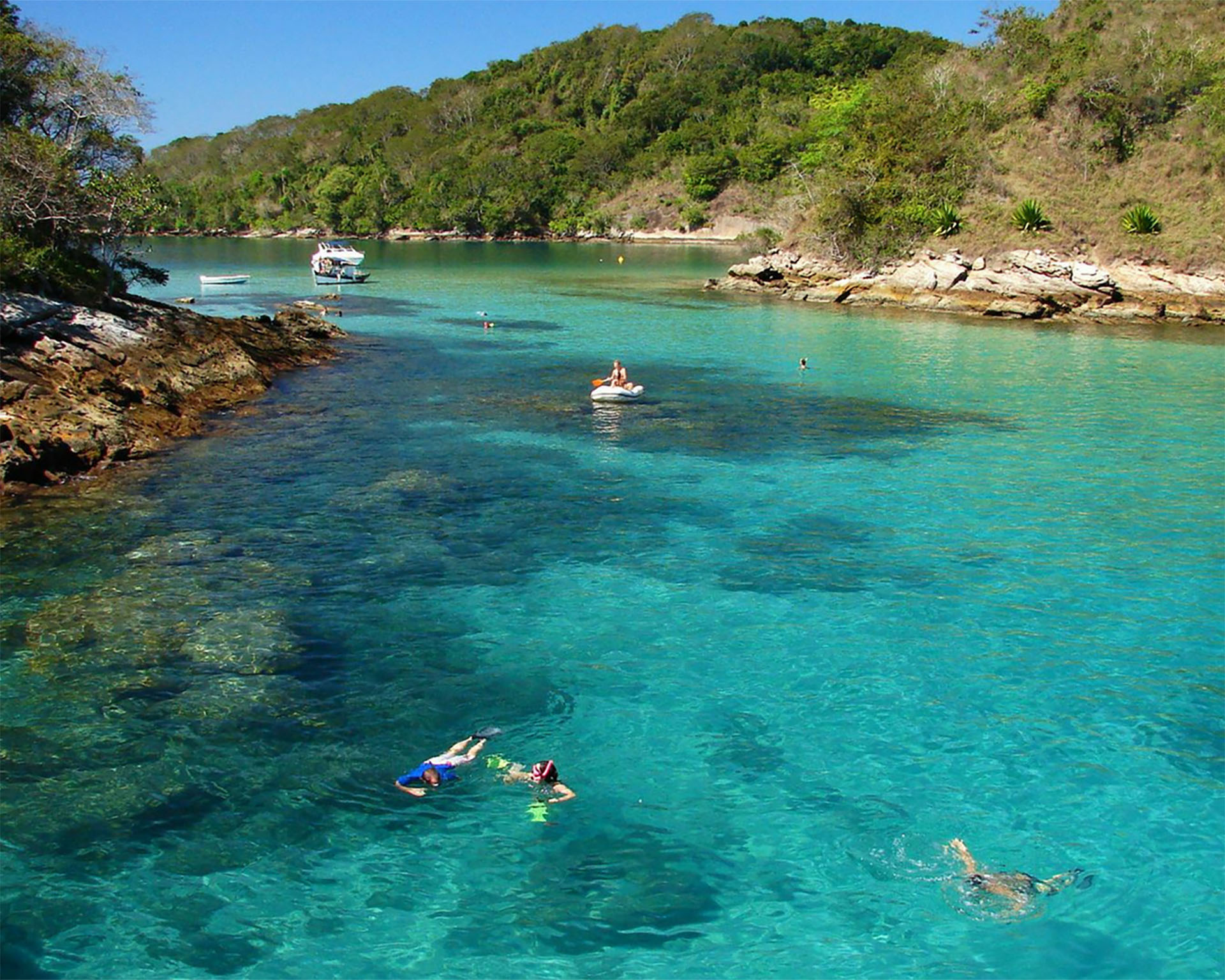 Swim through crystal-clear waters and kayak peacefully around stunning Ilha Grande coastline views