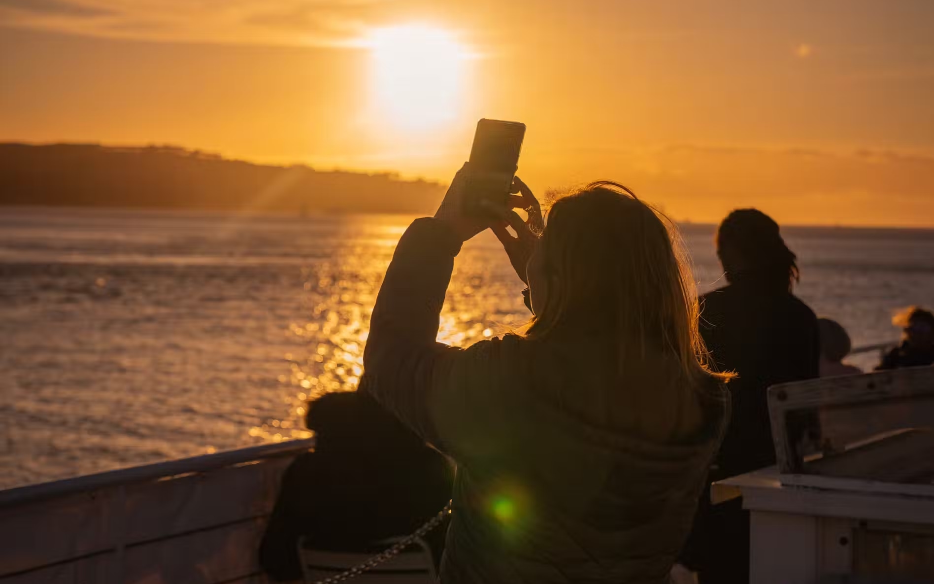 Capture the golden Lisbon sunset while cruising the Tagus River