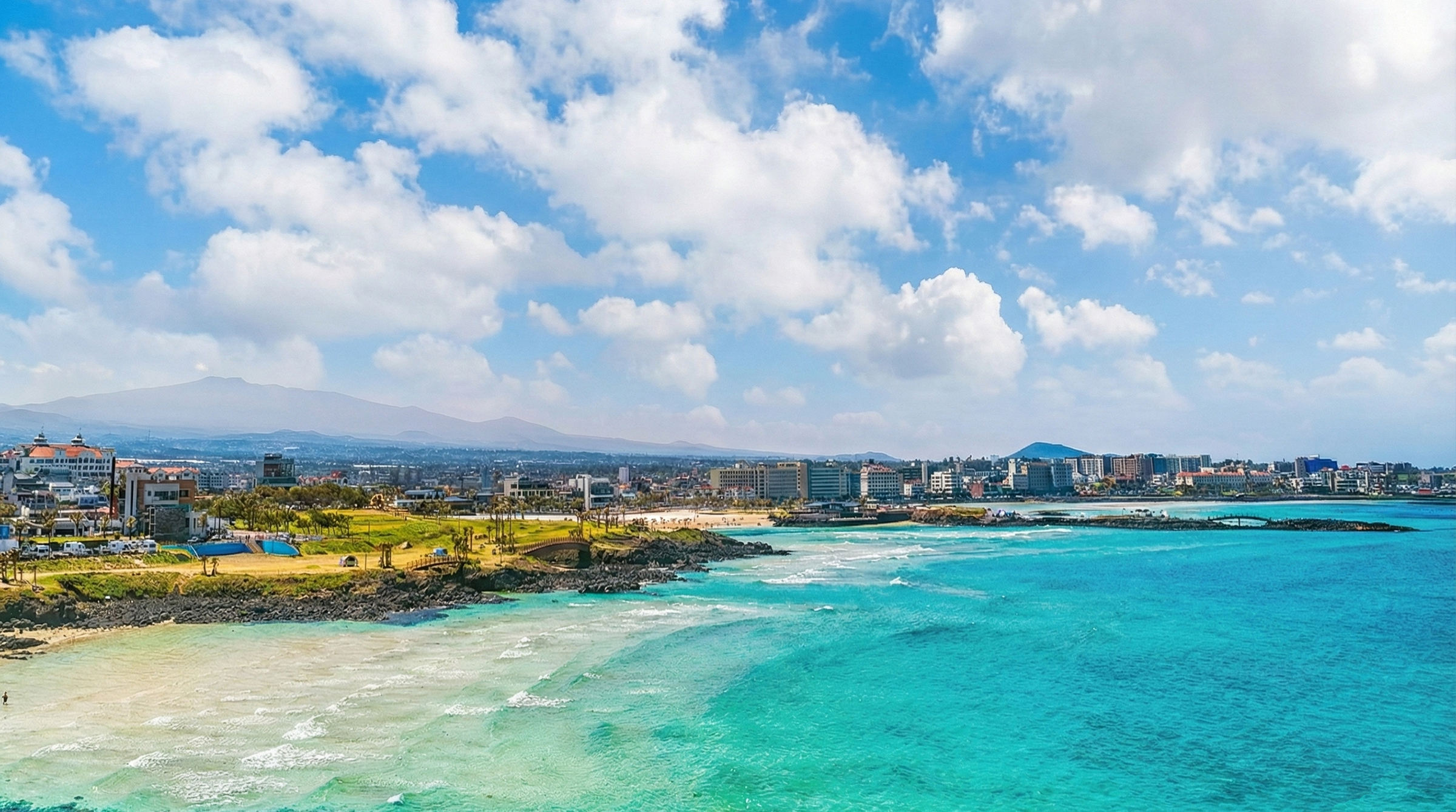 Hamdeok Beach is one of Jeju’s most popular beaches, known for its clear turquoise waters and white sand.