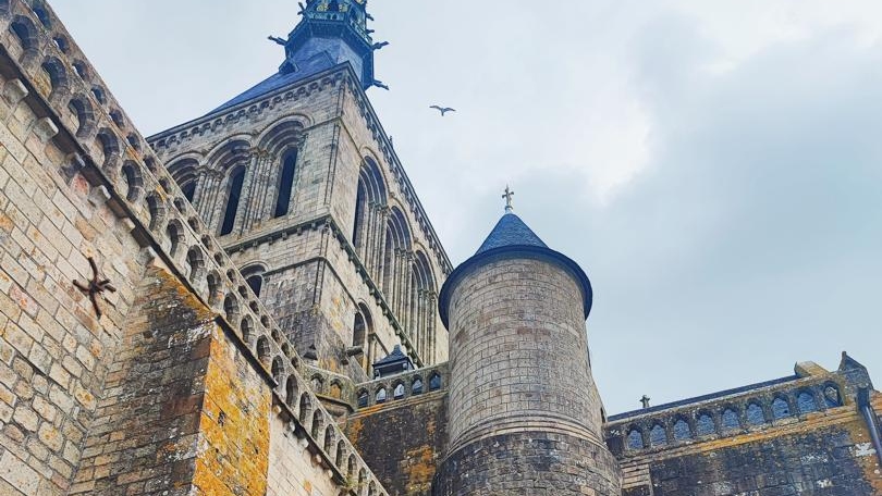 Capture the amazing view of Mont Saint-Michel, where sea and sky meet in beauty