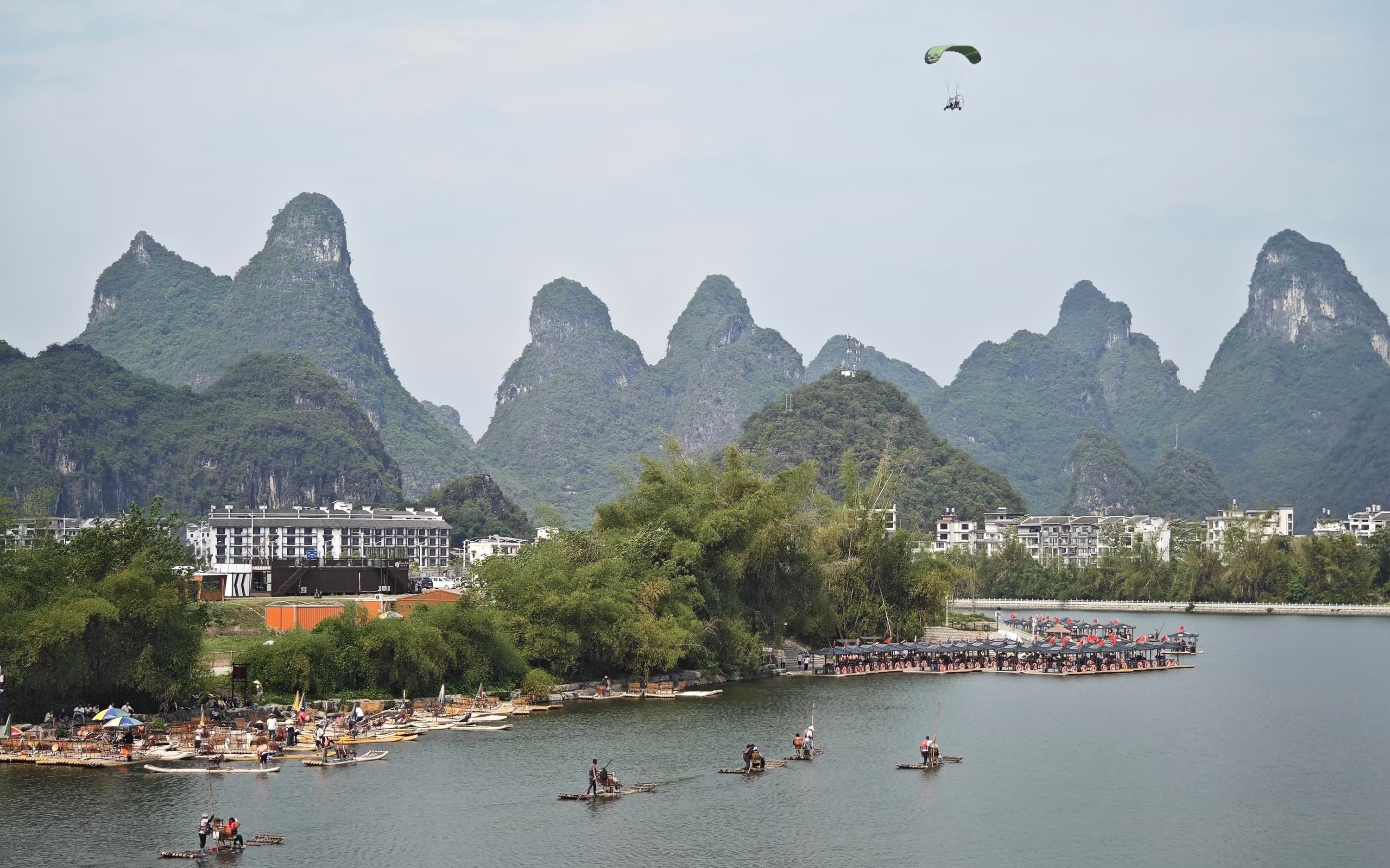Guilin Yulong River Bamboo Rafting + Fuli Bridge/Silver Cave + Shili Art Gallery Day Tour