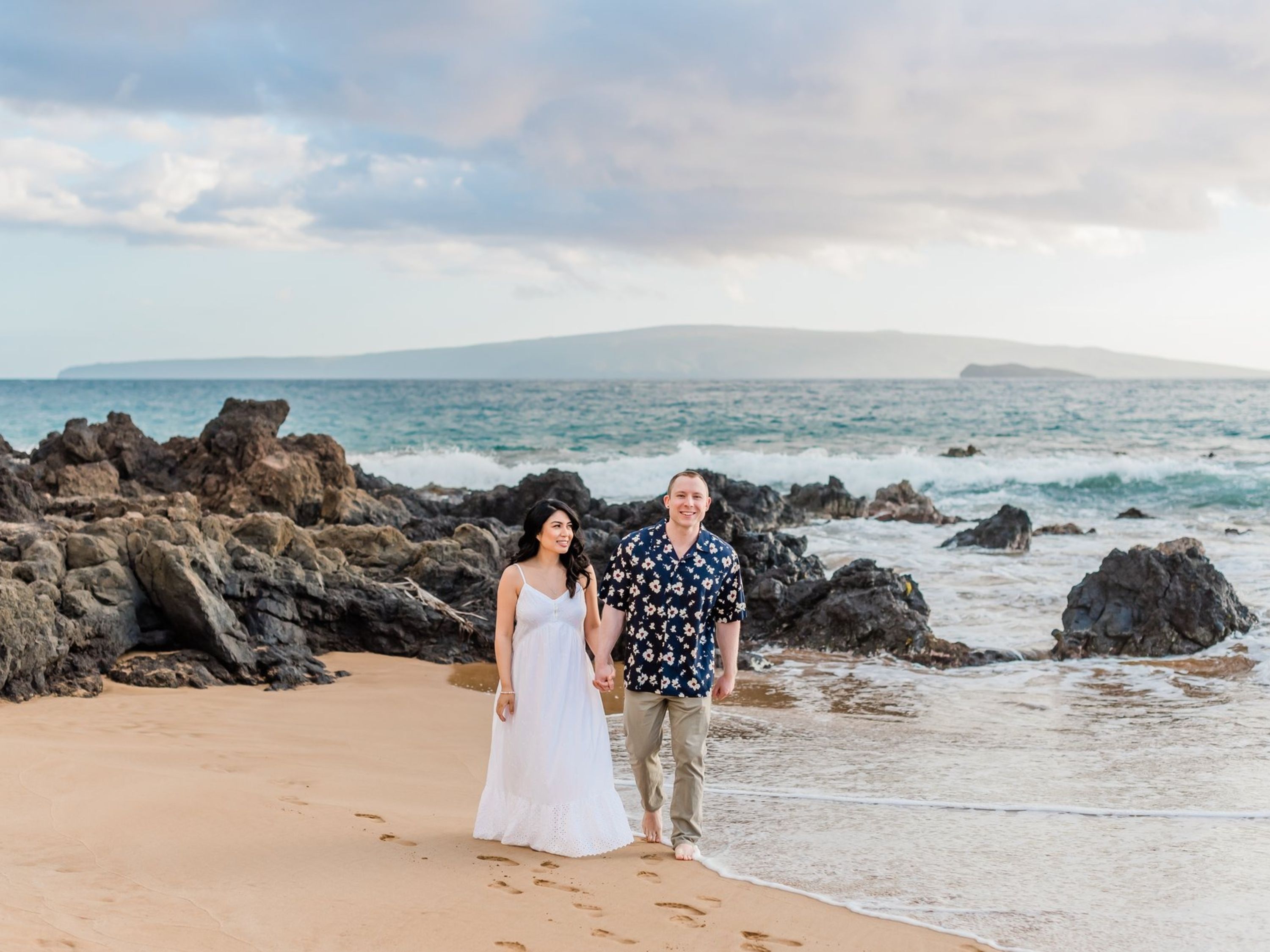 Capture a romantic stroll on the beach with your significant other