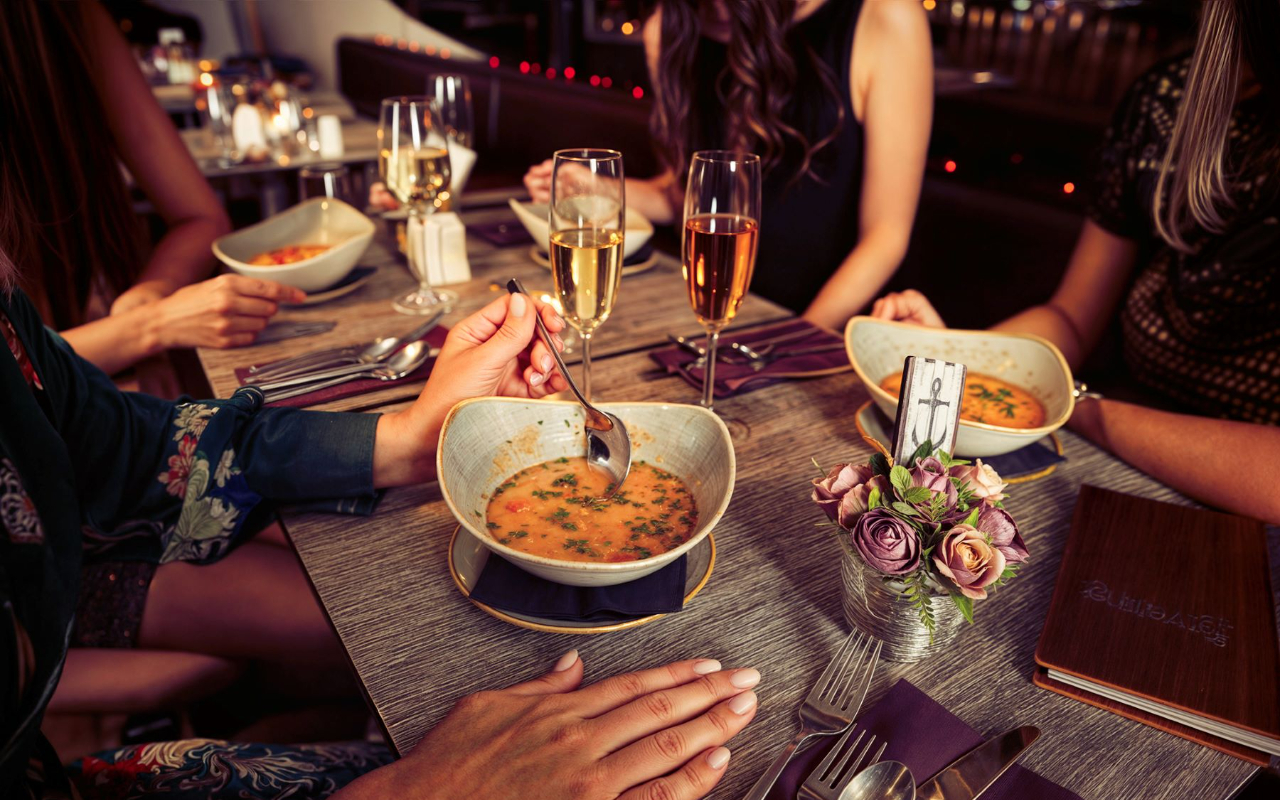 Enjoy a delicious multi-course dinner with friends while taking in the sights of Budapest