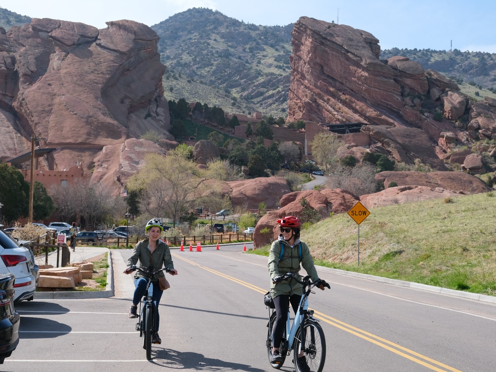 Ride as two bikers reach Red Rocks Amphitheatre under brilliant blue Colorado skies