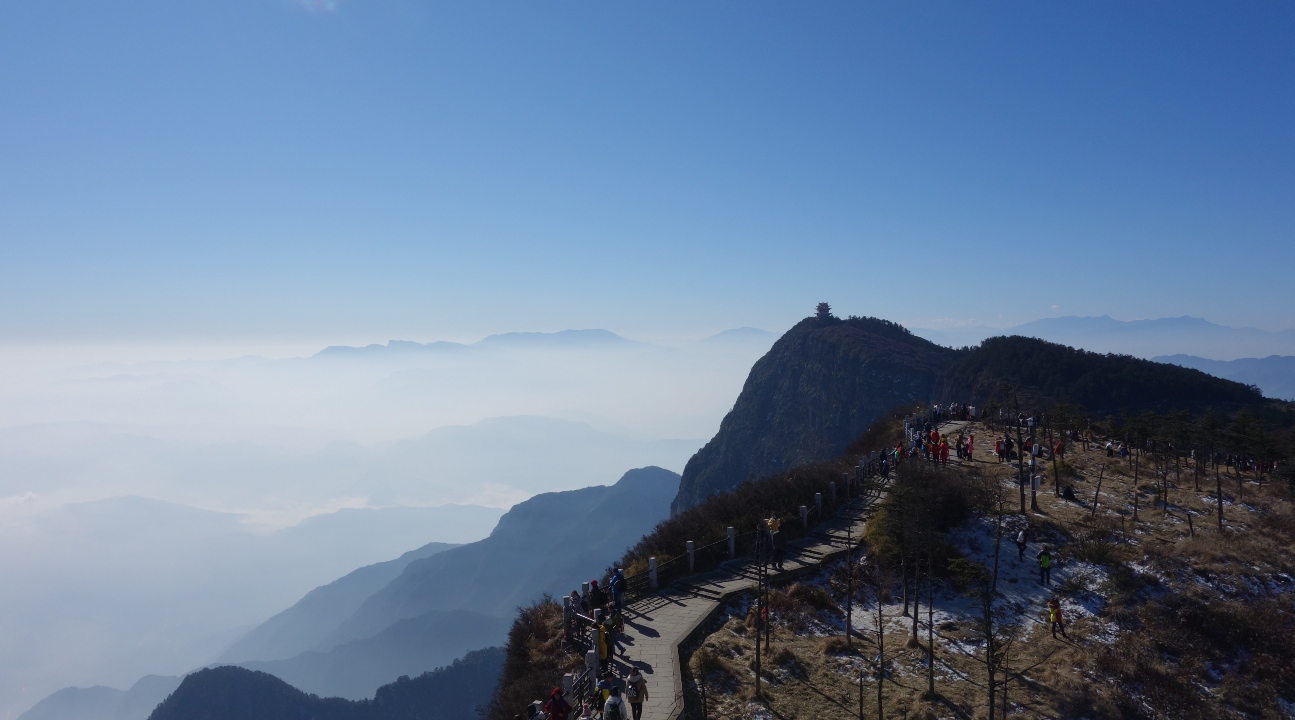 a panoramic view of a Mount Emei mountain path and the landscape below