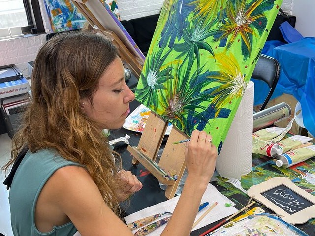 With every stroke of the knife, she turning blank canvases into textured explosions of creativity
