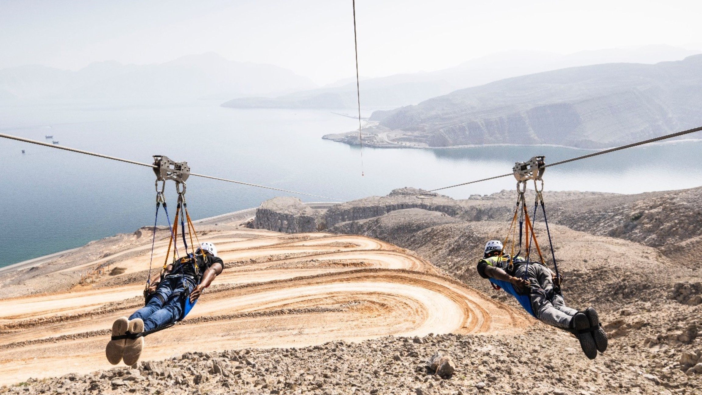 Take off from rocky heights and soar toward serene blue waters—thrill meets tranquility!