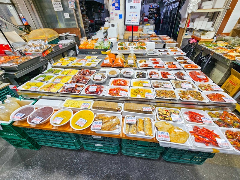 A vibrant traditional market near Suwon Hwaseong, offering a variety of food and daily necessities.