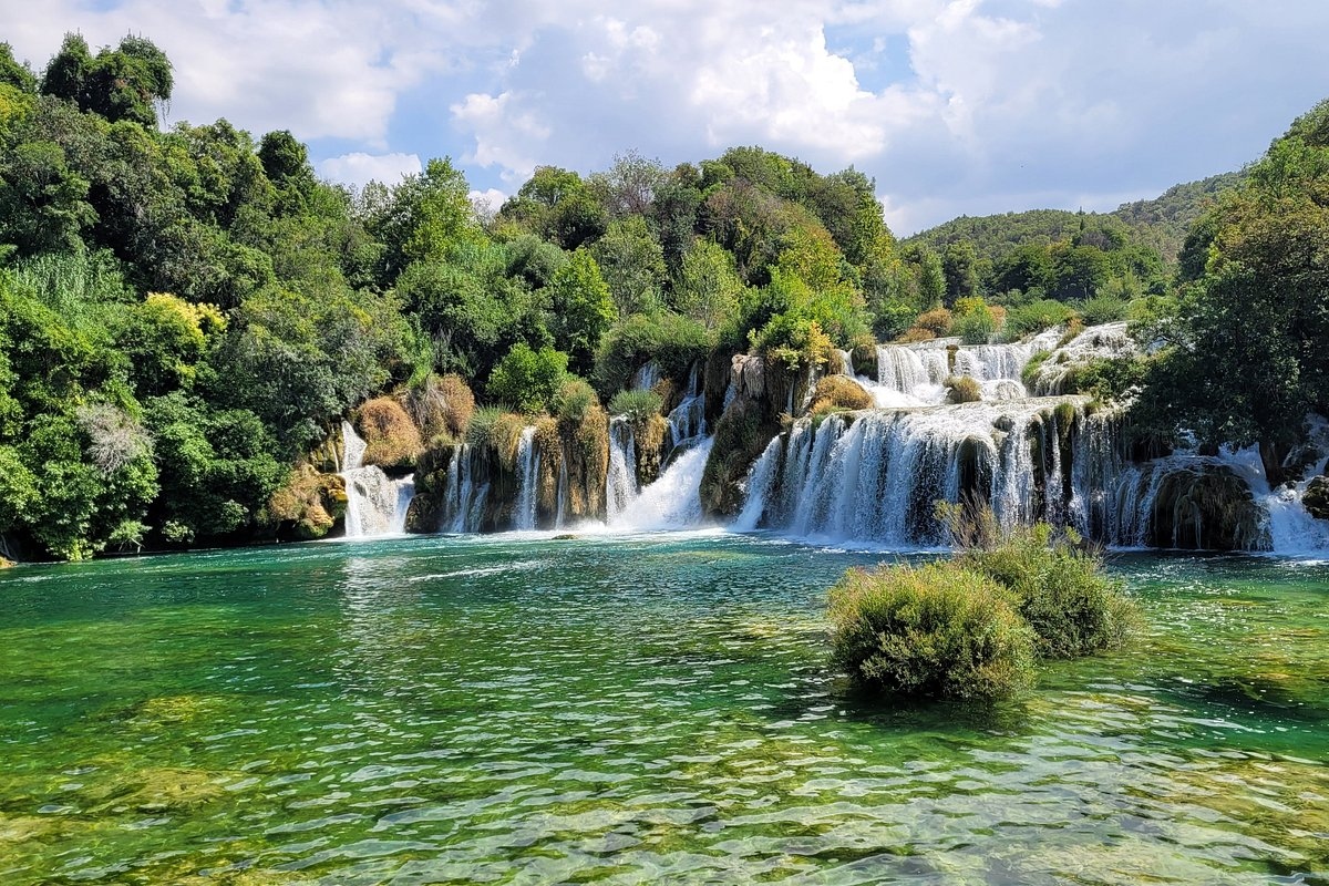 Experience the breathtaking beauty of the cascading Krka waterfalls in the heart of nature