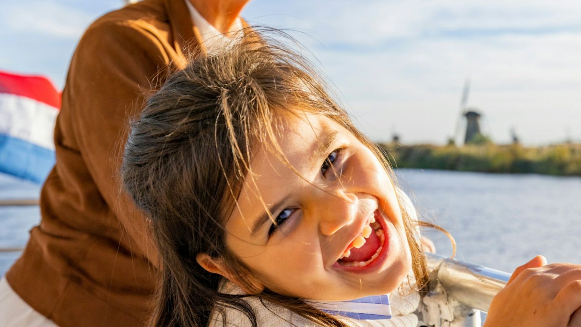 Enjoy a scenic boat tour along Kinderdijk's iconic windmills and stunning landscape
