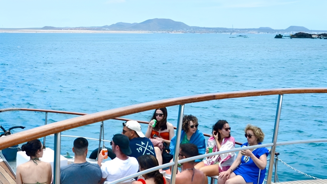 The ferry departs from Corralejo, offering stunning views of the turquoise waters of Fuerteventura