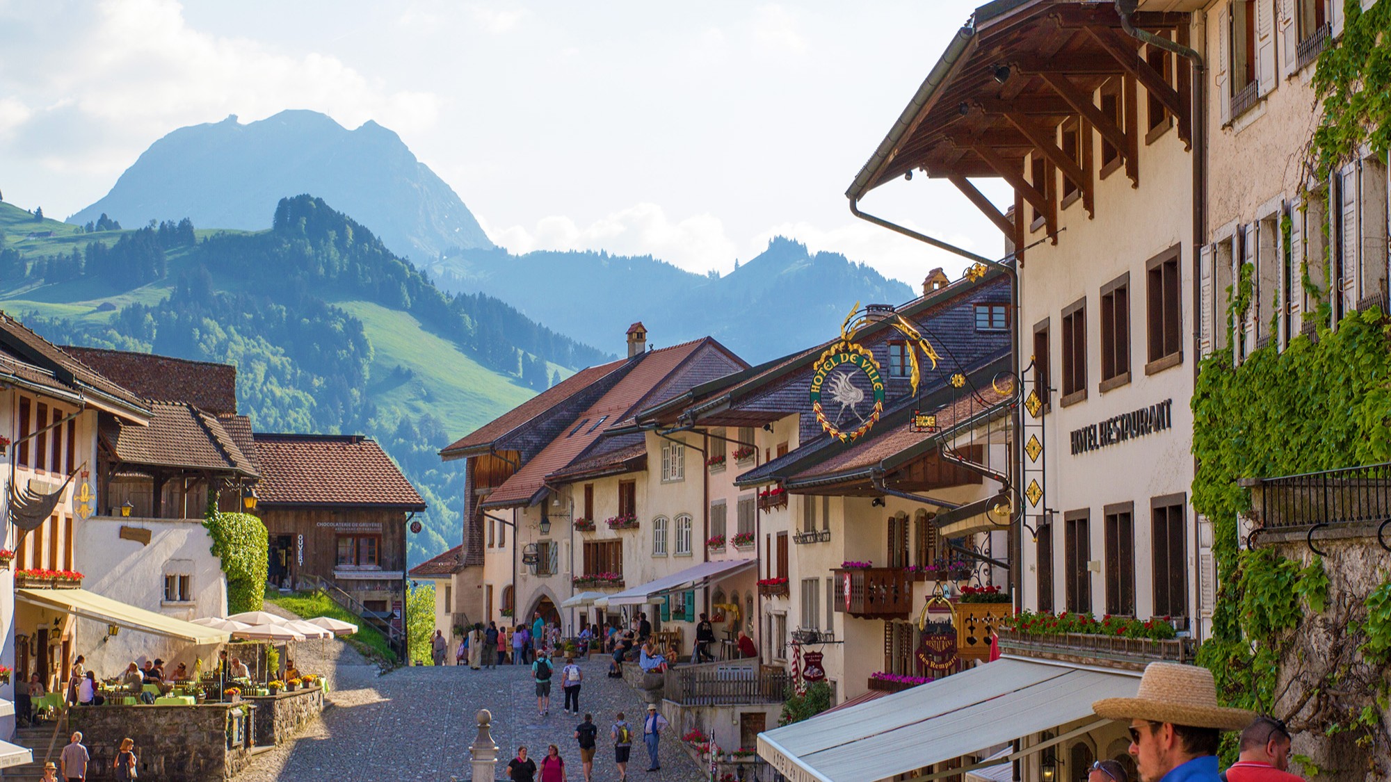 Stroll through the charming streets of Gruyeres, surrounded by alpine beauty and Swiss heritage