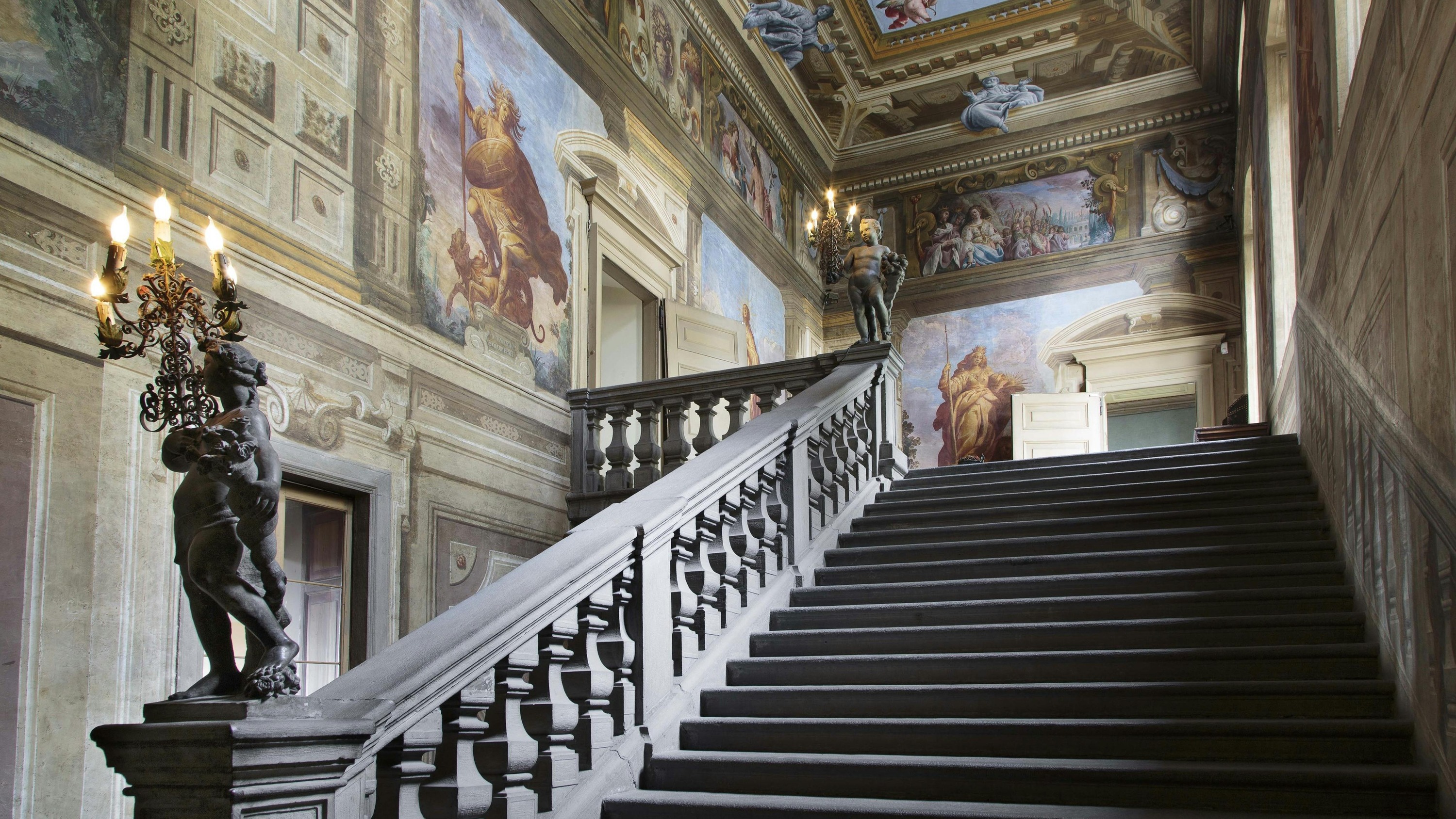Ascend the grand staircase of Villa Valmarana ai Nani, surrounded by captivating frescoes and artistic details