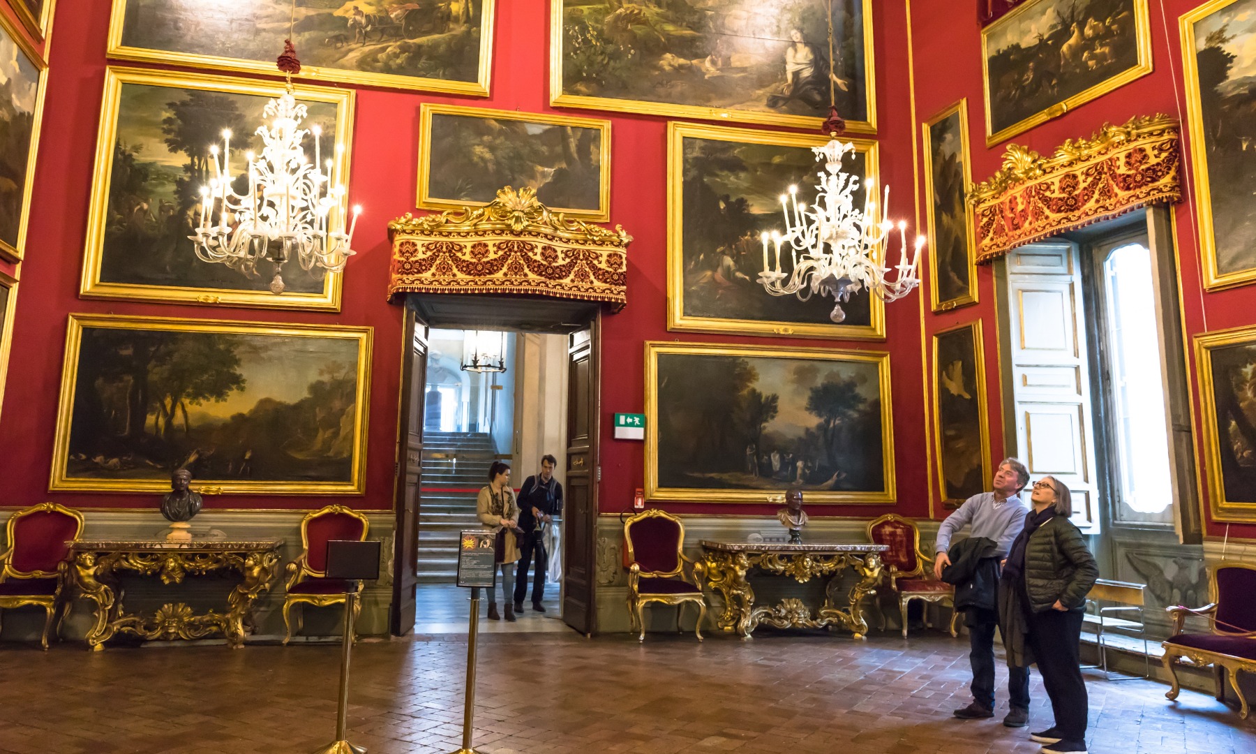 Admire the exquisite paintings that are hung from floor-to-ceiling